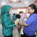 Ketua TP PKK Rindah Gaib Mokoginta Hadiri Sosialisasi Cegah Stunting, Serahkan Bantuan Susu dan Vitamin